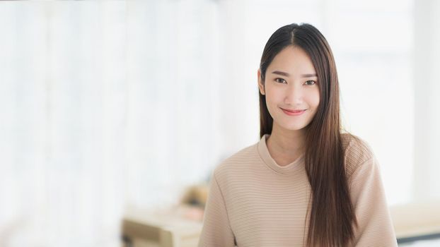 Beautiful Asia woman is smiling and happy with comfortable clothes. Banner of Asia woman
