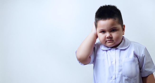 Boy in school uniform crying to school the first day. Children don't want to go to school.