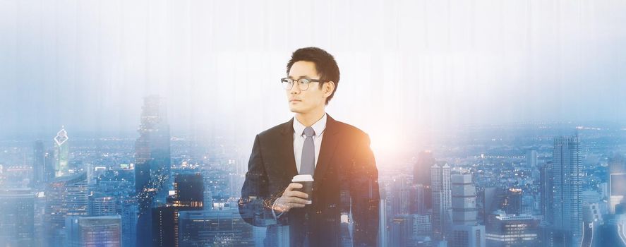 Double exposure of city and businessman using holding  coffee cup