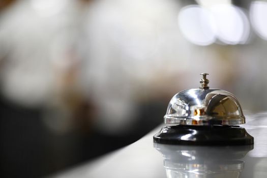 Bell on counter for service with blurred background