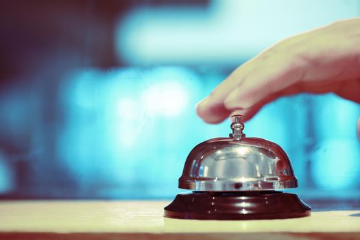 Bell on counter for service with blurred background