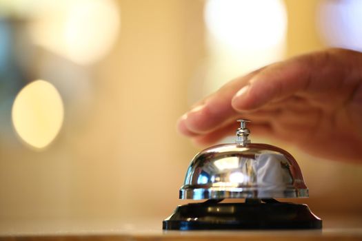 Bell on counter for service with blurred background