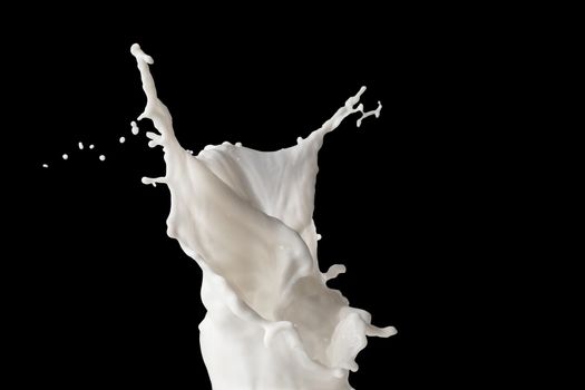 Milk or white liquid splash on dark background