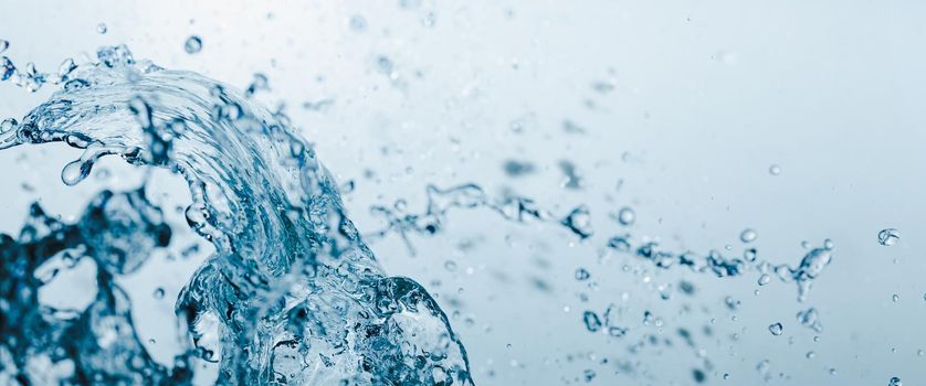 Water splash on blue abstract banner background