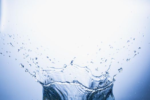 Water splash on blue abstract background