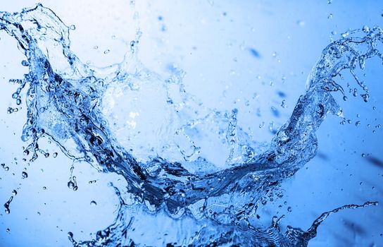 Water splash on blue abstract background