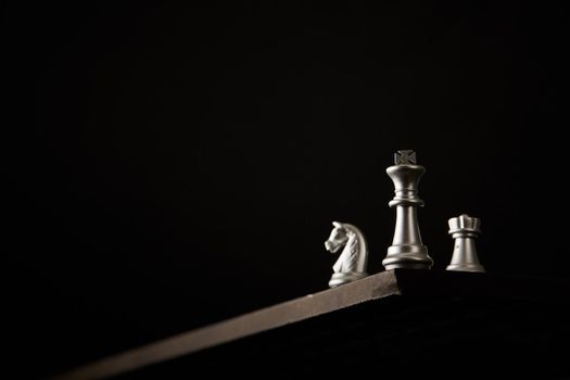 Chess 's king on top. Leader concept on dark background