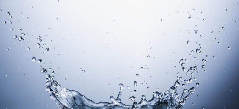 Water splash on blue abstract background