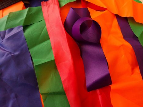 Colorful scraps of fabric in disarray on the table.