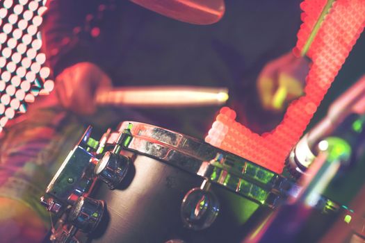 Drummer detail and stage lights.Live music background