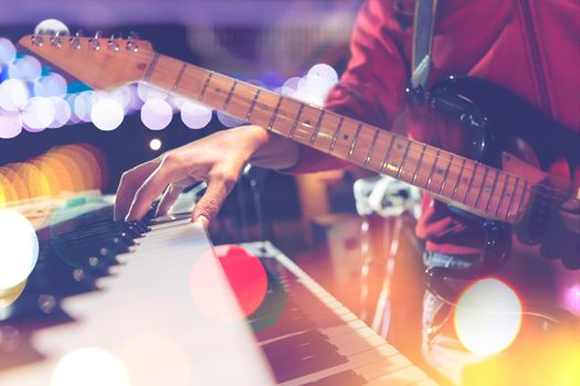 Guitar and piano keyboard detail.Live music and concert background