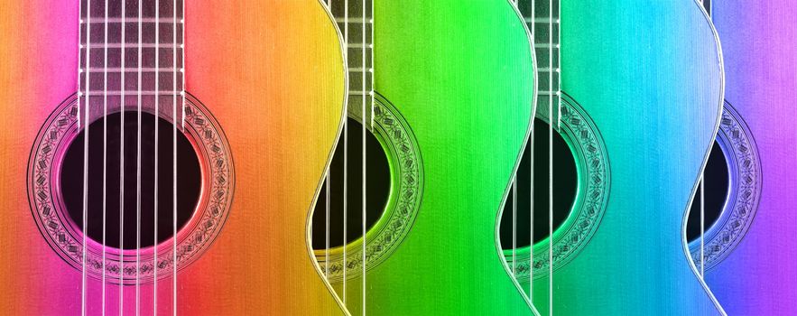 Multicolored acoustic and spanish guitar background.