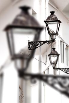 City and old streetlight detail.Town and urban architecture