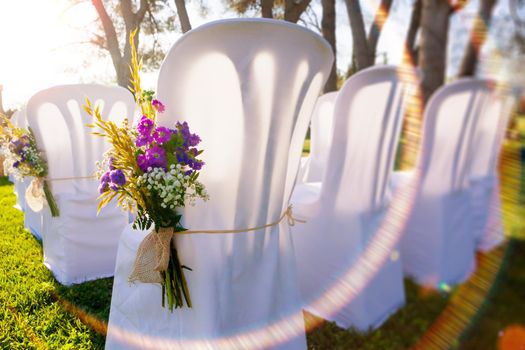 Bunch of flowers and chairs.Romantic and luxury celebration