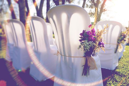 Bunch of flowers and chairs.Romantic and luxury celebration