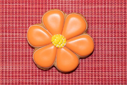 ginger cookies in the form of a flower on a red background. High quality photo