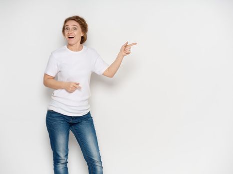 Woman shows thumb to the side on isolated background free space model