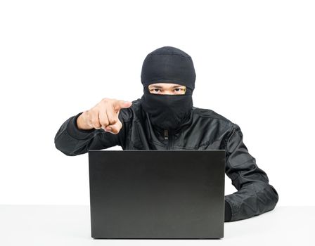 Hacker with laptop point finger isolate on white background