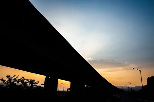 sunset scenery of highway bridge silhouette in the city