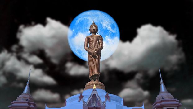 full blue moon and Buddha looking seven day style on the night sky, Elements of this image furnished by NASA