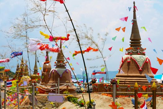 sand pagodas in Songkran festival represents In order to take the sand scraps attached to the feet from the temple to return the temple in the shape of a sand pagoda