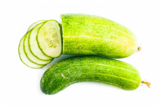 Raw cut sliced cucumber isolated on white.