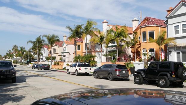 Oceanside, California USA - 27 Jan 2020: Typical suburban street. Different houses in row. Generic american homes, buildings facade, townhouse exterior architecture. Residential district real estate.