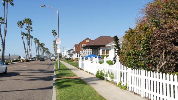Oceanside, California USA - 8 Feb 2020: Houses on suburban Pacific street. Generic buildings, residential district near Los Angeles. Real estate property exterior, typical american homes, palm trees.