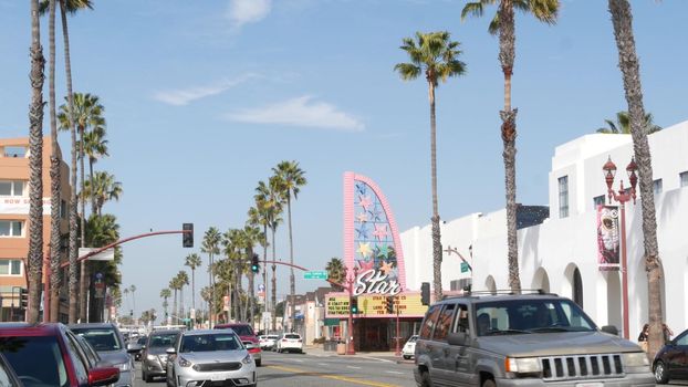 Oceanside, California USA - 20 Feb 2020: Authentic Star theatre on pacific coast highway 1, historic route 101. Palm trees on street, road along ocean. Retro vintage signboard. City near Los Angeles.