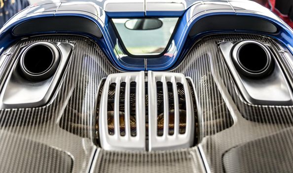 LONDON, UK - CIRCA JUNE 2014: Porsche 918 Spyder top mounted exhaust system and engine cover detail shot.