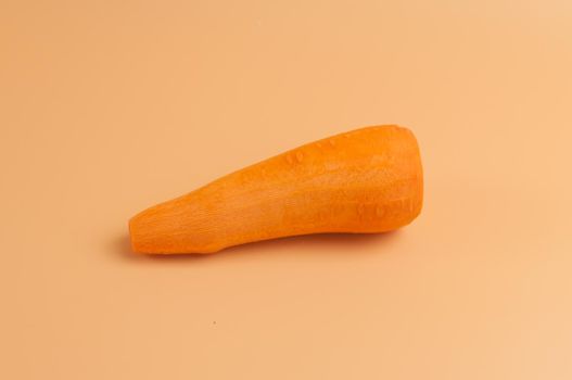 organic carrot pure on beige background,peeled sweet carrots on the surface, young carrots from the garden in a minimalist style, vitamins, vegetarian food, healthy eating concept.Template for design.