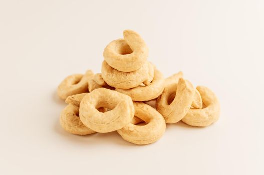 Taralli - a traditional Italian appetizer similar to drying or bagels, typical for the cuisine of Sicily and Calabria. Bagel on a white background, isolate. Copy space.