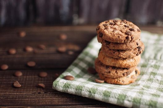 Oatmeal liver lies near the napkin in the box. Rustic table. Vintage toning. Dietary useful cookies without gluten. Copy space.