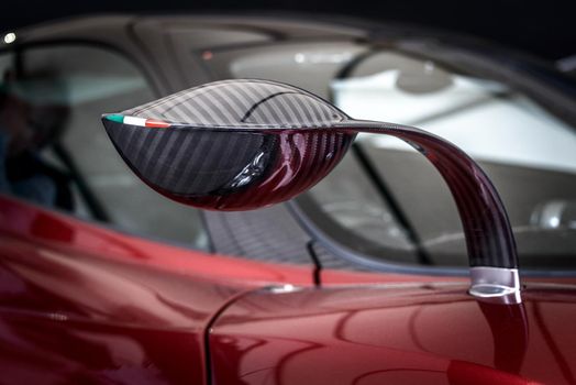 LONDON, UK - CIRCA JUNE 2014: Carbon fibre Pagani Huayra wing mirror with Italian flag.