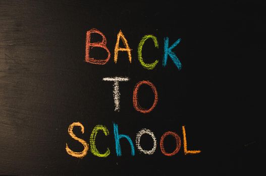 Back to school, the concept of parenting. The inscription on the blackboard colored chalk.