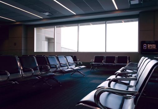 Empty seats at the waiting area of an airport.