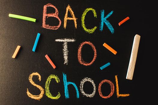 Back to school, the concept of parenting. The inscription on the blackboard colored chalk.