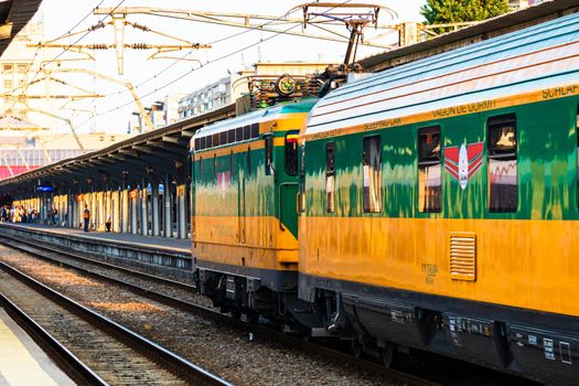 Detail of train in motion at train platform at Bucharest North Railway Station (Gara de Nord Bucharest) in Bucharest, Romania, 2020