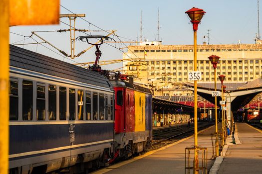 Detail of train in motion at train platform at Bucharest North Railway Station (Gara de Nord Bucharest) in Bucharest, Romania, 2020