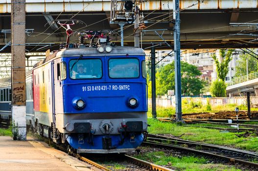 Detail of train in motion at train platform at Bucharest North Railway Station (Gara de Nord Bucharest) in Bucharest, Romania, 2020