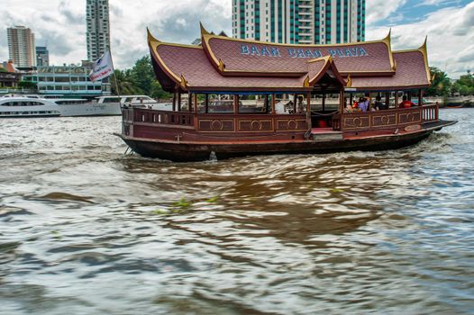 Bangkok, Thailand - 21 Jul 2019 : An ancient rice boat built for a shuttle boat for hotel travelers.