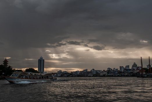 Bangkok, Thailand - 21 Jul 2019: Skyscrapers along the Chao Phraya River in the evening Making Bangkok a beautiful city