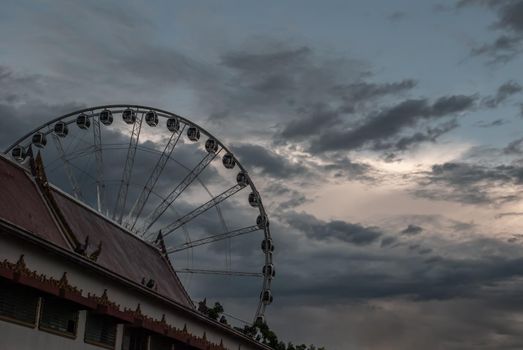 Bangkok, thailand 21 Jul, 2019 : Wat Ratcha Singkhon with Asiatique Ferris Wheel and Blue Sky at the Background.