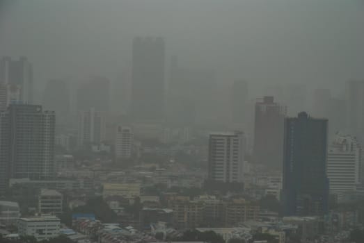 Bangkok, Thailand - 25 Jul, 2019: Morning sky view of Bangkok with skyscrapers in fog, city view, downtown business district concept.