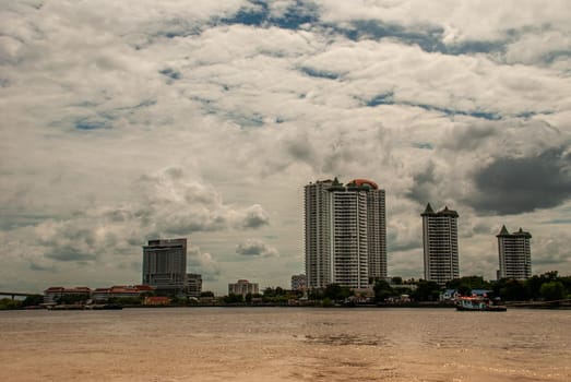 Bangkok, Thailand - 21 Jul 2019: Bangkok skyscrapers along the Chao phraya make it a beautiful city.