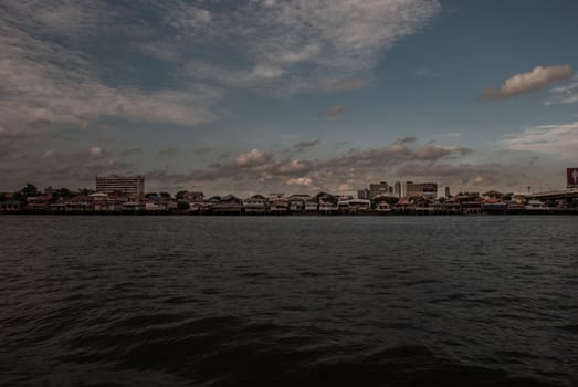 Bangkok, Thailand - 21 Jul 2019 : A view of the Chao Phraya River showing the several buildings in the evening along the Chao Phraya riverside in the beautiful skyline.