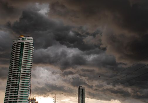 Bangkok, Thailand - 21 Jul 2019 : Beautiful clouds and sky with sun rays over the city, before heavy rain, Landscape of building in the city