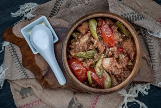 Chinese Cuisine - Fish deep Fried in Sour-Sweet Sauce in wooden bowl. Top view.