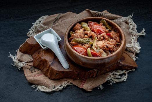 Chinese Cuisine - Fish deep Fried in Sour-Sweet Sauce in wooden bowl. Oblique view from the top.