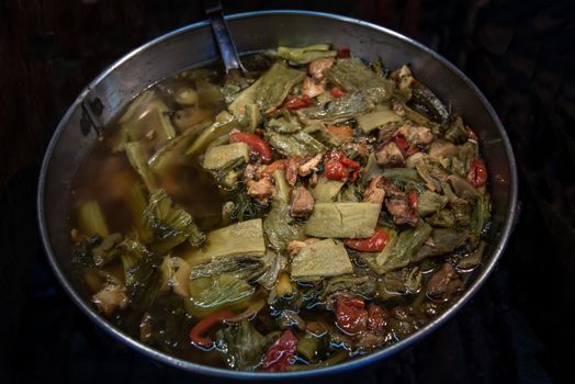 Bitter gourd and pickle mustard with pork spare rib soup. Chinese style. Oblique view from the top, Selective focus.